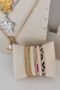 Fencyjewels armbanden en kettingen – gouden stainless steel sieraden met kralen en bloemenbedels, trendy en betaalbaar, perfect voor een stijlvolle look.