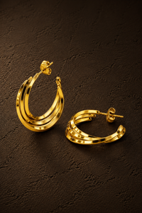 Gouden Twist hoops van Fencyjewels met een opvallende gedraaide structuur en glanzende afwerking.
