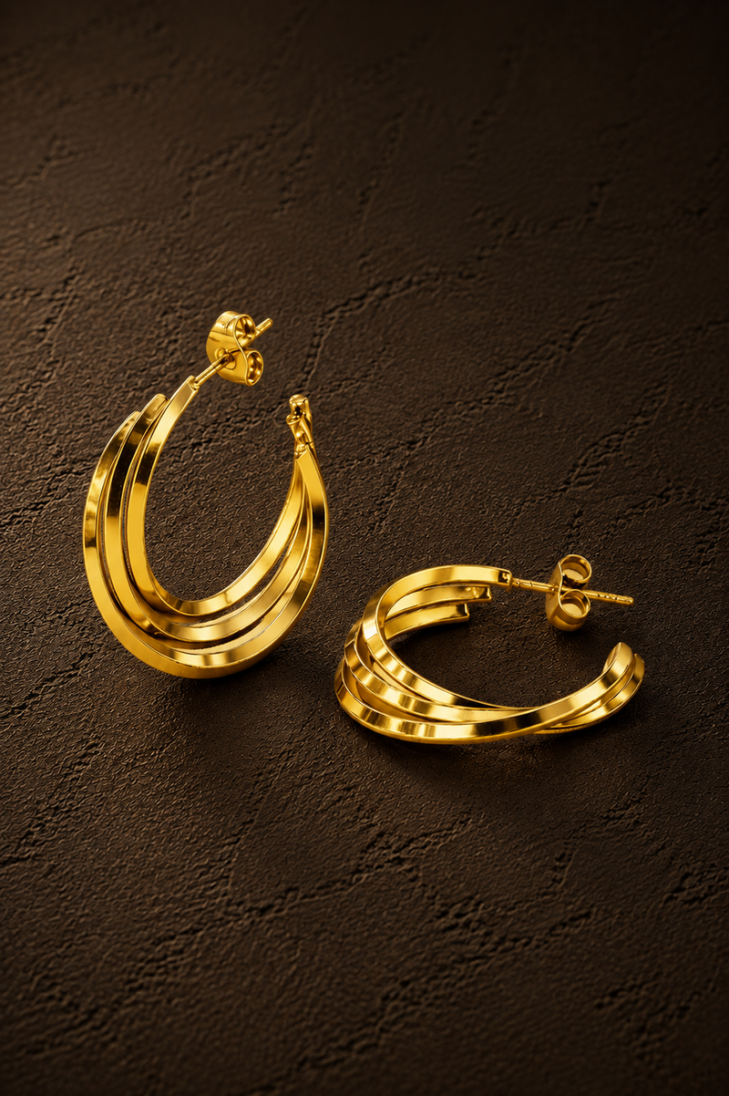 Gouden Twist hoops van Fencyjewels met een opvallende gedraaide structuur en glanzende afwerking.