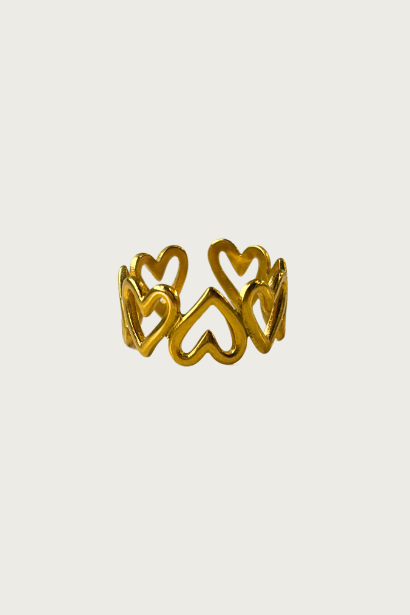 Fencyjewels gouden hartjesring – verstelbare damesring met opengewerkte hartvormen, trendy en elegant design, ideaal als cadeau of fashion statement.